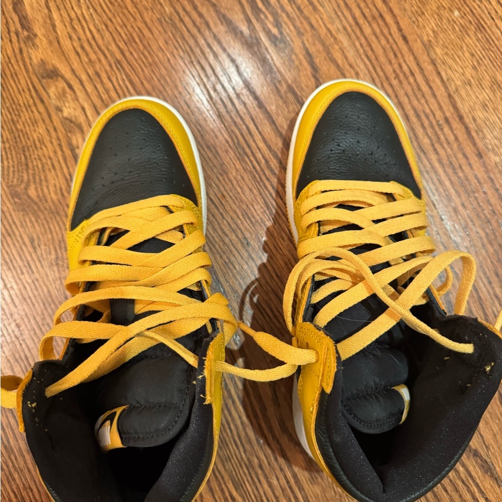 Nike Air Jordan 1 Retro High OG Black and Yellow High-Top Sneakers.